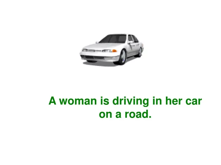 a woman is driving in her car on a road
