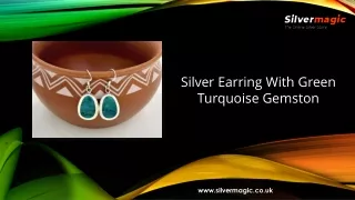 silver earring with green turquoise gemston